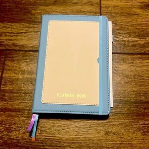 Blue and cream planner book with all type of organizational pages.